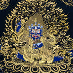 Kagyu Mahakal Thangka Painting showing a wrathful Tibetan Buddhist Dharma protector in black and gold style with blue details, skull crown, skull cup, flame aura, lotus base, gold clouds, lineage figure and Himalayan landscape.