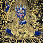 Kagyu Mahakal Thangka Painting showing a wrathful Tibetan Buddhist Dharma protector in black and gold style with blue details, skull crown, skull cup, flame aura, lotus base, gold clouds, lineage figure and Himalayan landscape.
