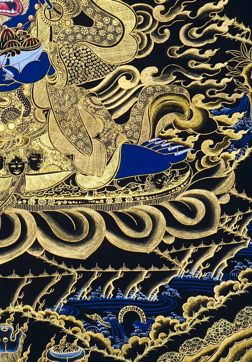 Kagyu Mahakal Thangka Painting showing a wrathful Tibetan Buddhist Dharma protector in black and gold style with blue details, skull crown, skull cup, flame aura, lotus base, gold clouds, lineage figure and Himalayan landscape.