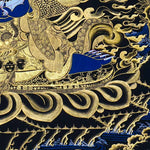 Kagyu Mahakal Thangka Painting showing a wrathful Tibetan Buddhist Dharma protector in black and gold style with blue details, skull crown, skull cup, flame aura, lotus base, gold clouds, lineage figure and Himalayan landscape.