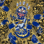Close-up detail of Six Hand Mahakala Thangka Painting, six-armed wrathful protector in black, gold and blue with flame motifs and lotus base