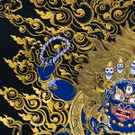Close-up detail of Six Hand Mahakala Thangka Painting, six-armed wrathful protector in black, gold and blue with flame motifs and lotus base