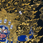 Close-up detail of Six Hand Mahakala Thangka Painting, six-armed wrathful protector in black, gold and blue with flame motifs and lotus base