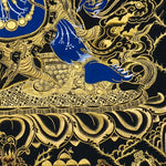 Close-up detail of Six Hand Mahakala Thangka Painting, six-armed wrathful protector in black, gold and blue with flame motifs and lotus base