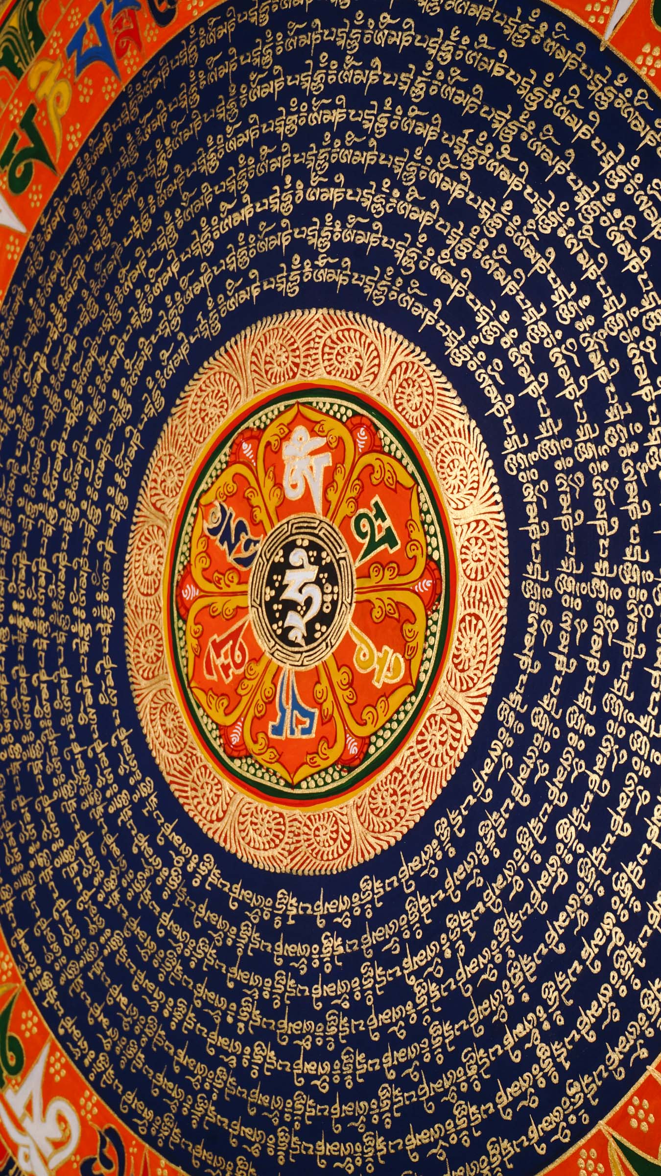 Tibetan mantra mandala artwork with sacred script and decorative floral borders