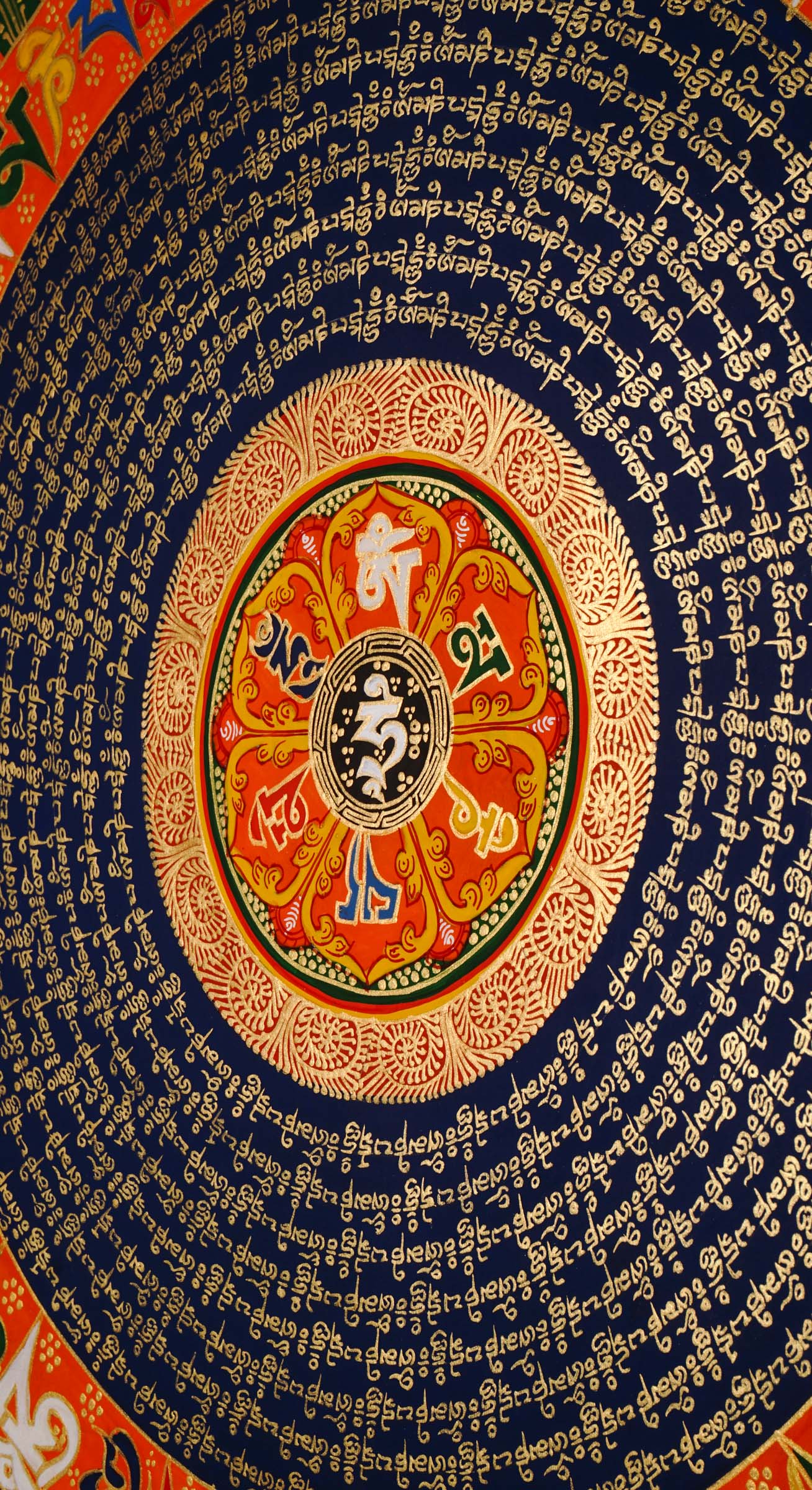 Tibetan mantra mandala artwork with sacred script and decorative floral borders