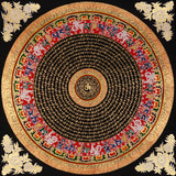 Tibetan mantra mandala artwork with gold script on black background