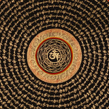 Tibetan mantra mandala artwork with gold script on black background