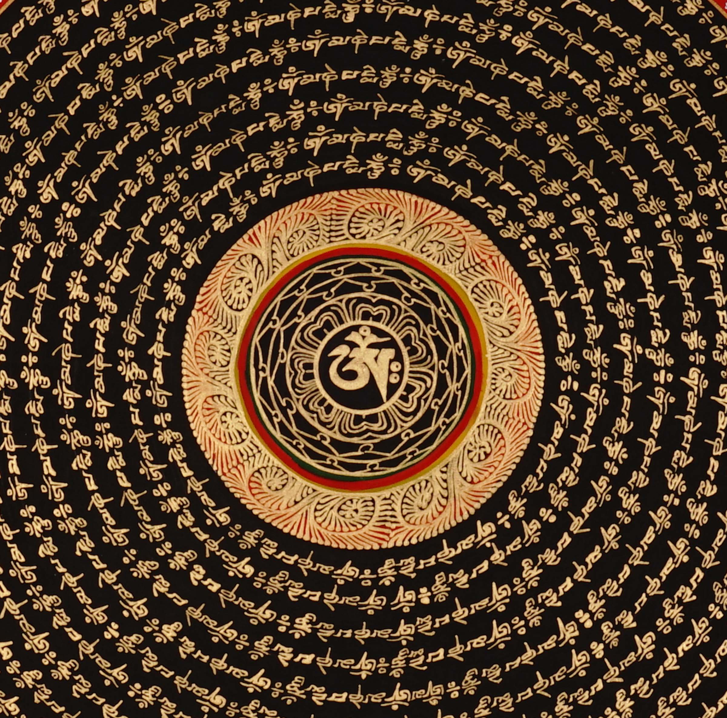 Tibetan mantra mandala artwork with gold script on black background