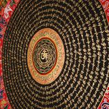Tibetan mantra mandala artwork with gold script on black background