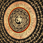 Tibetan mantra mandala artwork with gold script on black background
