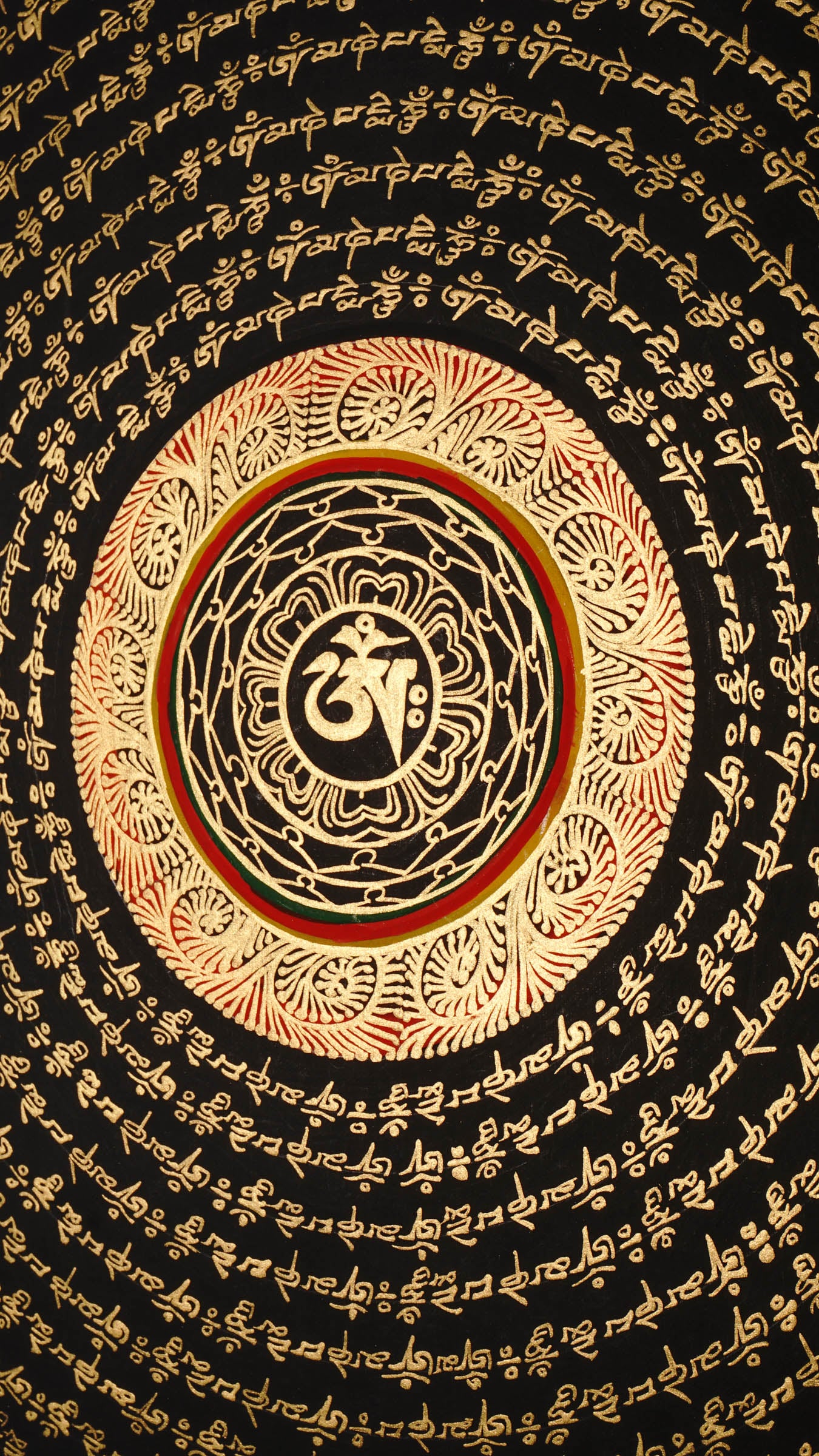 Tibetan mantra mandala artwork with gold script on black background