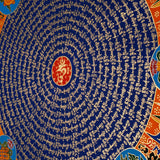 Tibetan mantra mandala with eight auspicious symbols and sacred script