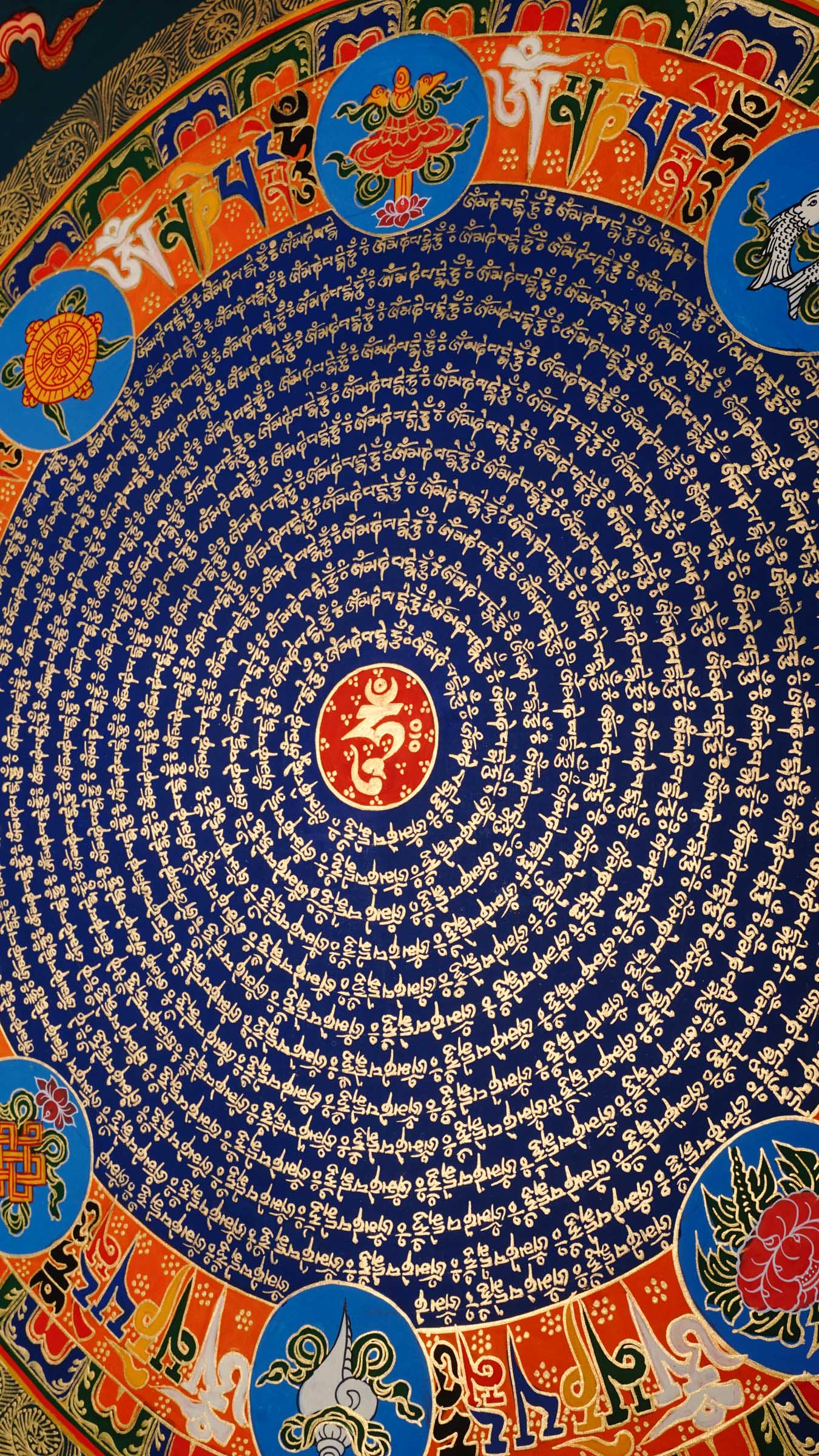 Tibetan mantra mandala with eight auspicious symbols and sacred script