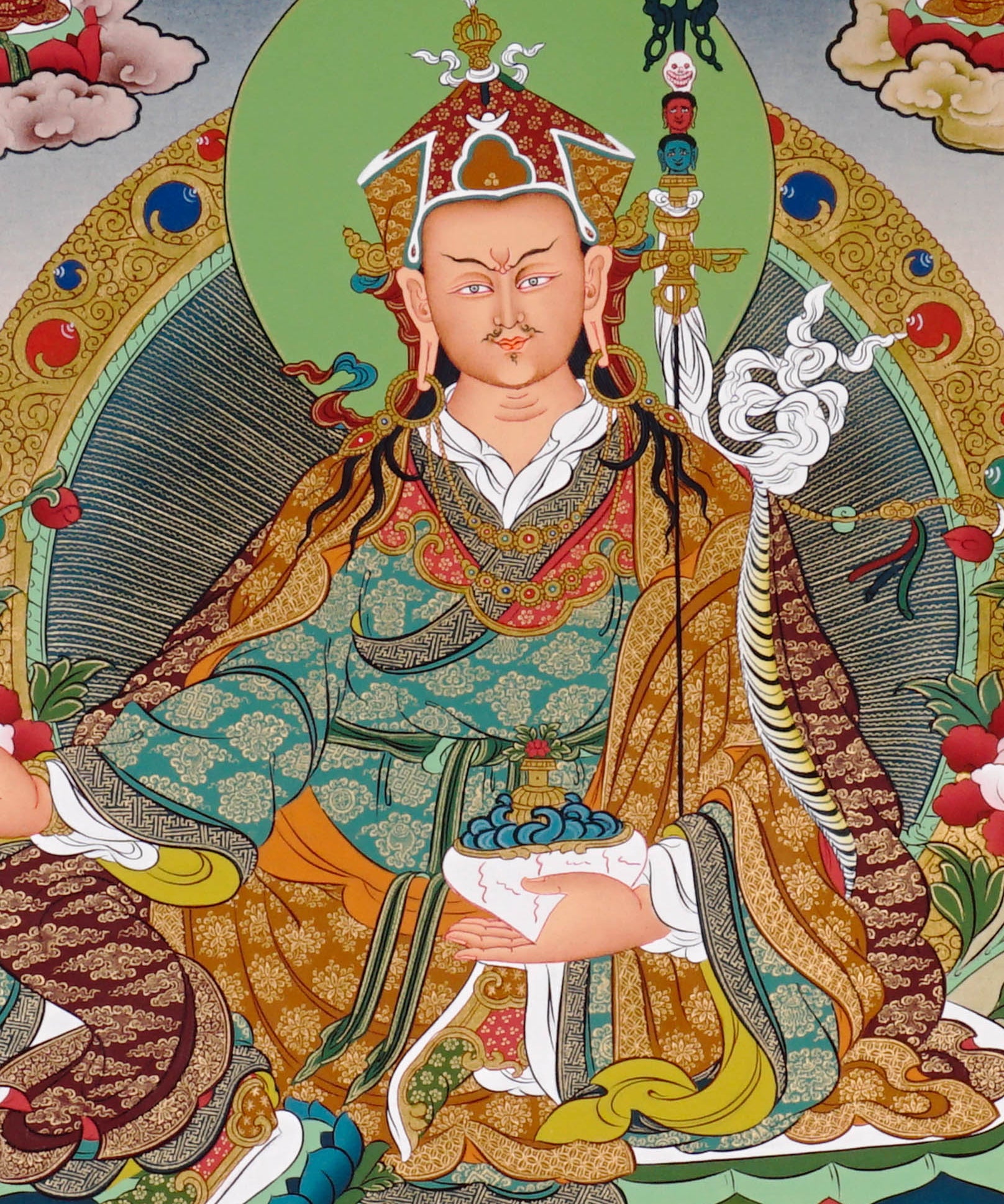 Guru Rinpoche thangka painting featuring Padmasambhava seated on a lotus throne with vajra, skull cup, offering bowl, surrounding deities, mountains and flowing water 