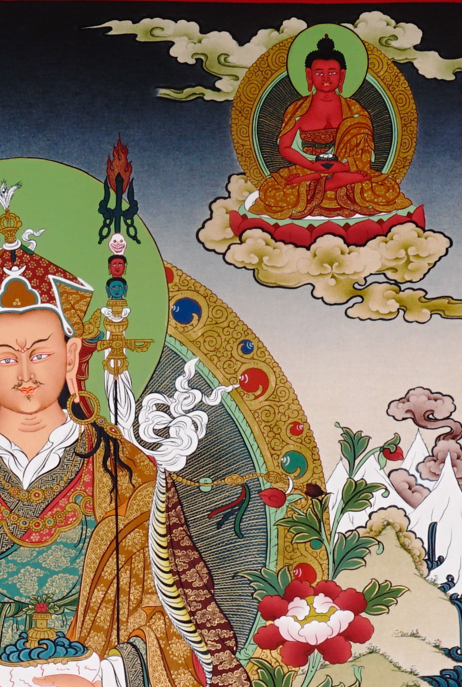 Guru Rinpoche thangka painting featuring Padmasambhava seated on a lotus throne with vajra, skull cup, offering bowl, surrounding deities, mountains and flowing water 