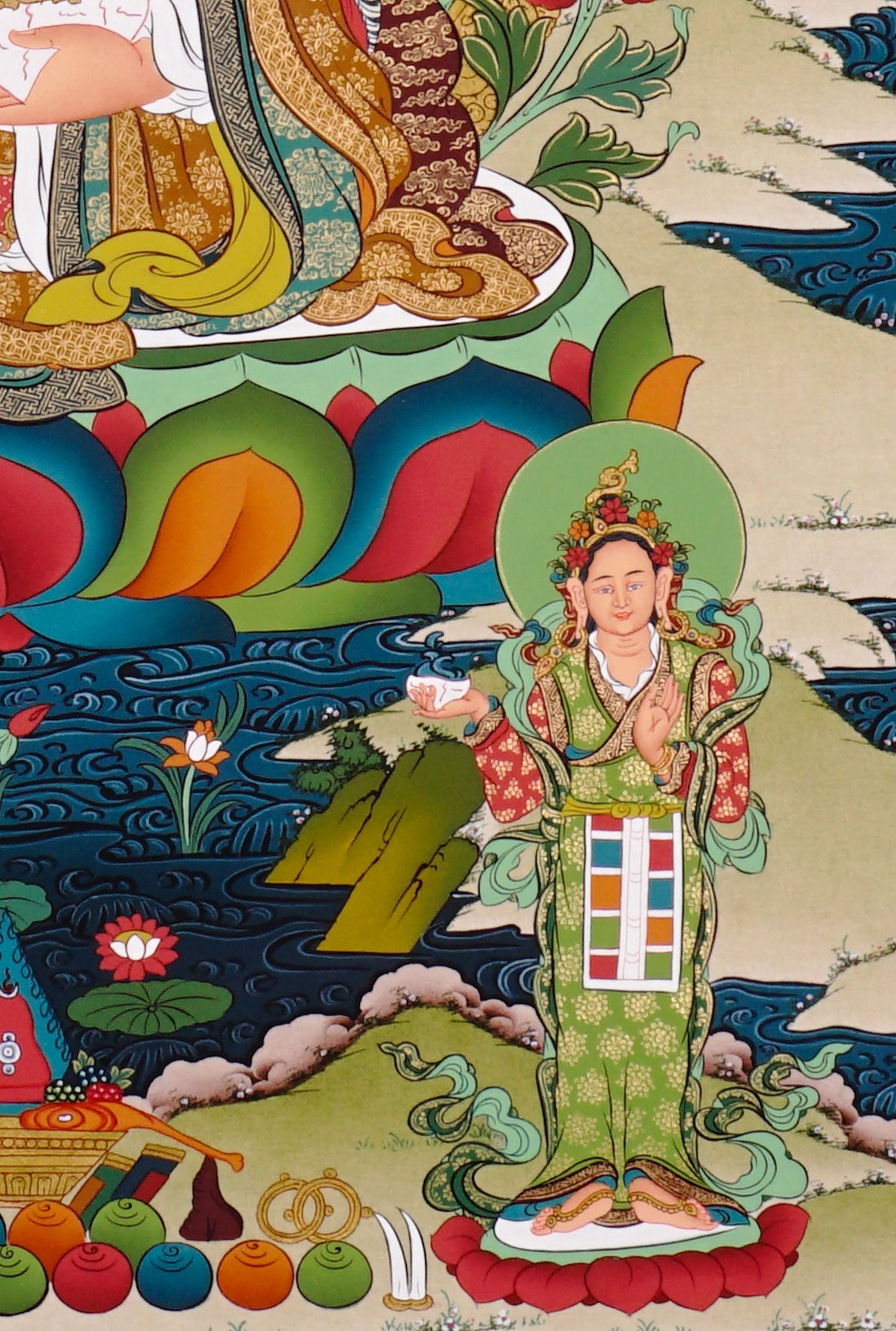 Guru Rinpoche thangka painting featuring Padmasambhava seated on a lotus throne with vajra, skull cup, offering bowl, surrounding deities, mountains and flowing water 