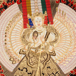 Dukkar thangka painting featuring the White Umbrella Goddess Sitatapatra with many arms, sacred implements, flame aura, gold-tone details