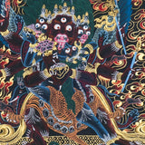 Close-up detail of Vajrakilaya Thangka Painting, wrathful Vajrakilaya in black and gold with multiple arms, skull crown and lotus base