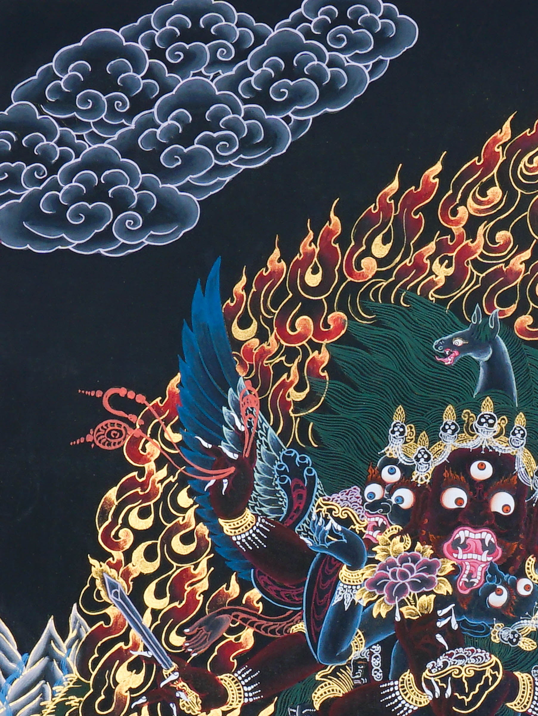Close-up detail of Vajrakilaya Thangka Painting, wrathful Vajrakilaya in black and gold with multiple arms, skull crown and lotus base