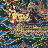 Close-up detail of Vajrakilaya Thangka Painting, wrathful Vajrakilaya in black and gold with multiple arms, skull crown and lotus base