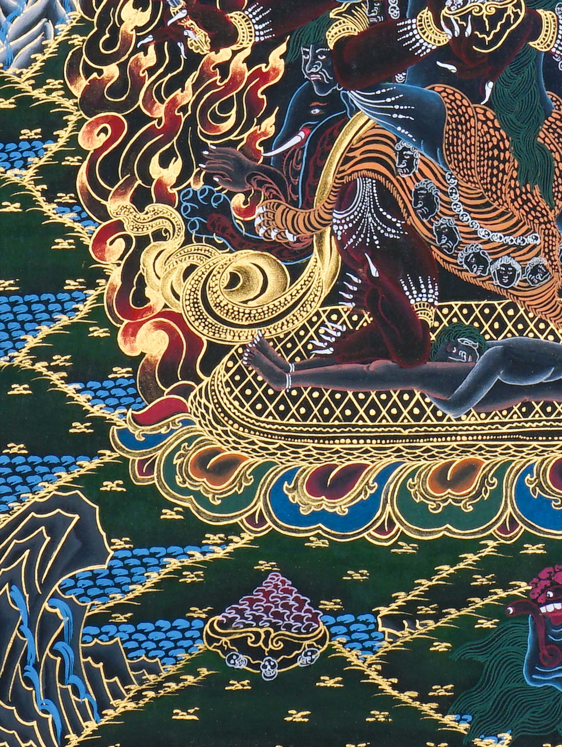 Close-up detail of Vajrakilaya Thangka Painting, wrathful Vajrakilaya in black and gold with multiple arms, skull crown and lotus base