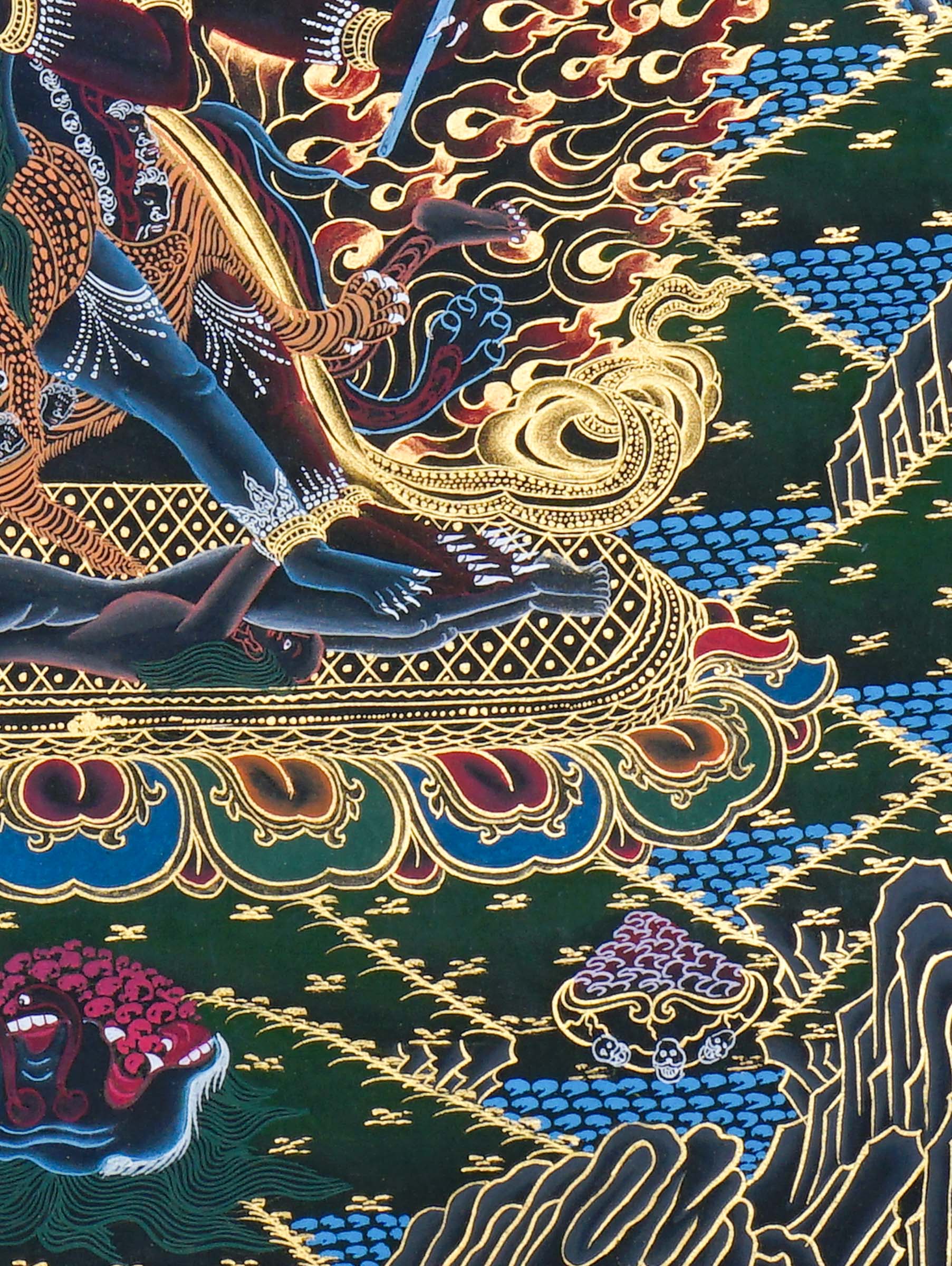 Close-up detail of Vajrakilaya Thangka Painting, wrathful Vajrakilaya in black and gold with multiple arms, skull crown and lotus base
