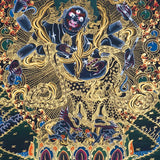 Six Hand Mahakala Thangka Painting showing a wrathful Tibetan Buddhist protector deity with six arms, flame aura, ritual implements, offering symbols, lotus base and Himalayan landscape in black, gold, blue and red tones.