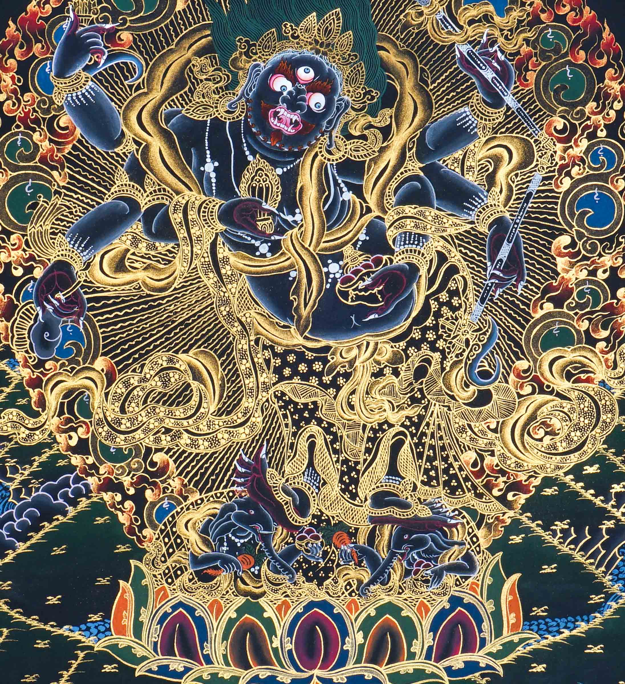 Six Hand Mahakala Thangka Painting showing a wrathful Tibetan Buddhist protector deity with six arms, flame aura, ritual implements, offering symbols, lotus base and Himalayan landscape in black, gold, blue and red tones.