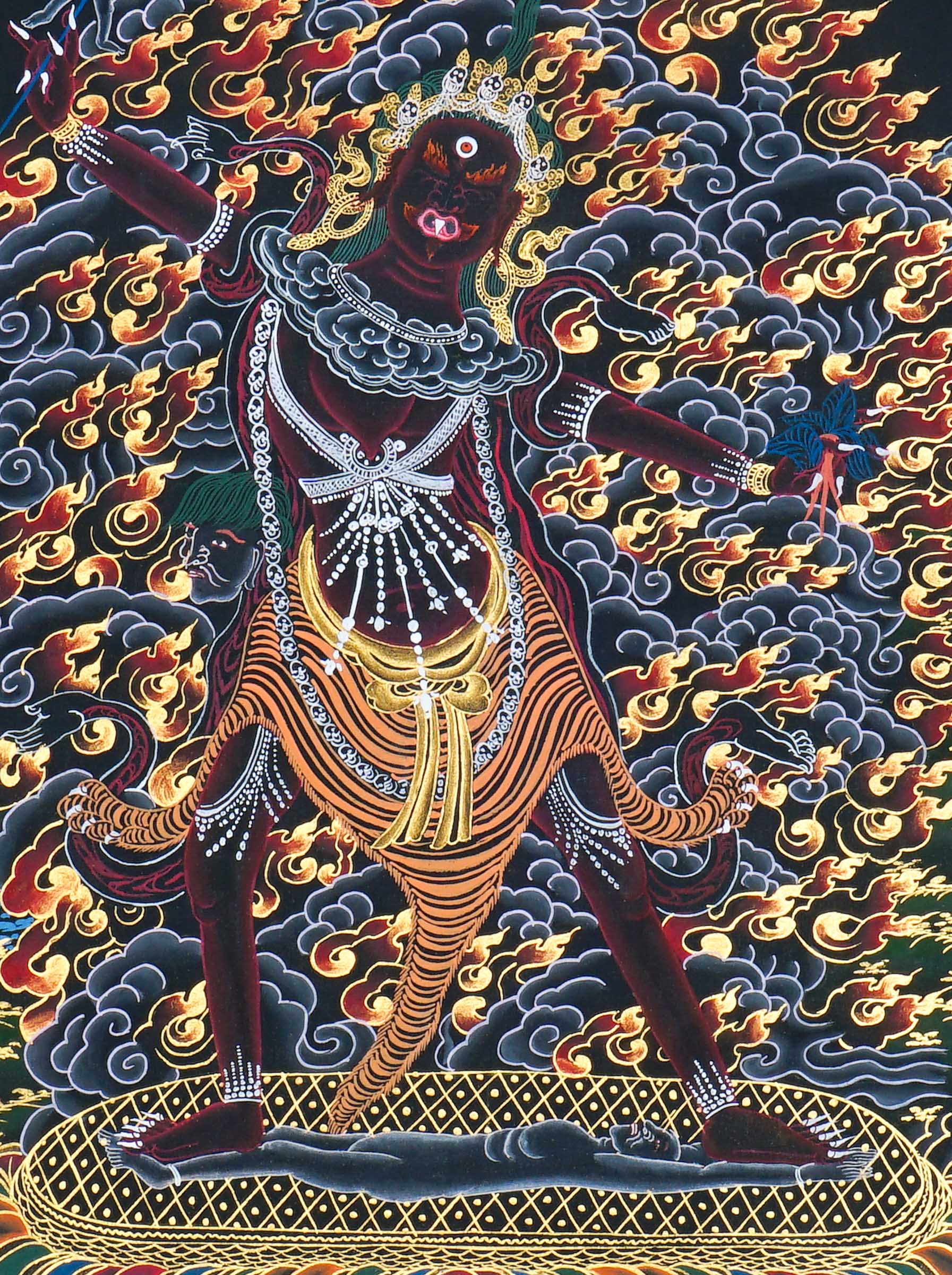 Close up of Ekajati Thangka Painting showing a wrathful female protector deity surrounded by flames, dark clouds.