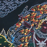 Close up of Ekajati Thangka Painting showing a wrathful female protector deity surrounded by flames, dark clouds.