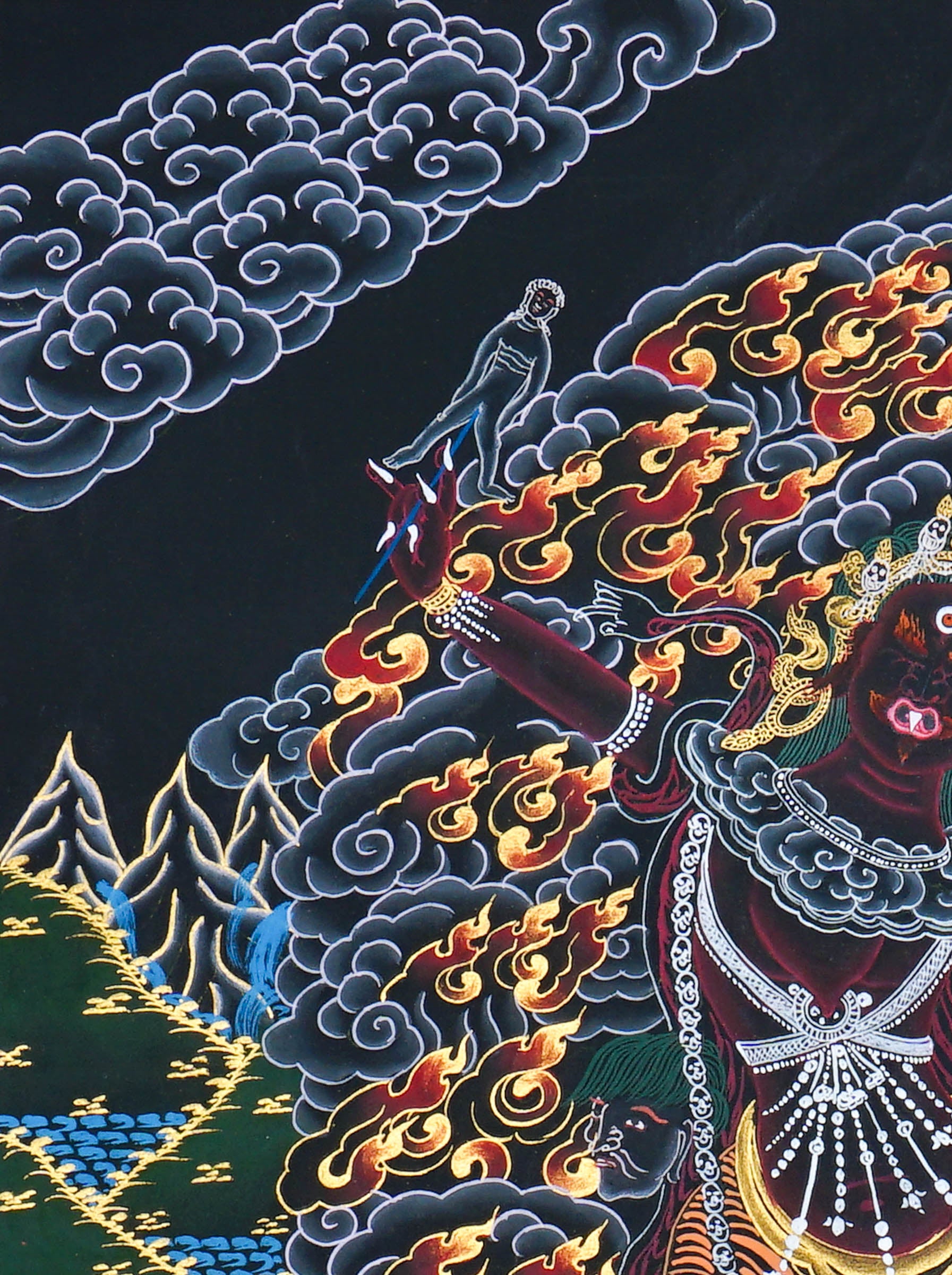 Close up of Ekajati Thangka Painting showing a wrathful female protector deity surrounded by flames, dark clouds.