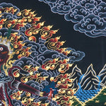 Close up of Ekajati Thangka Painting showing a wrathful female protector deity surrounded by flames, dark clouds.