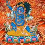 Vajrapani thangka painting showing a blue wrathful Tibetan Buddhist protector deity holding a raised vajra, surrounded by flames and seated on a lotus throne against a vivid orange-red background.