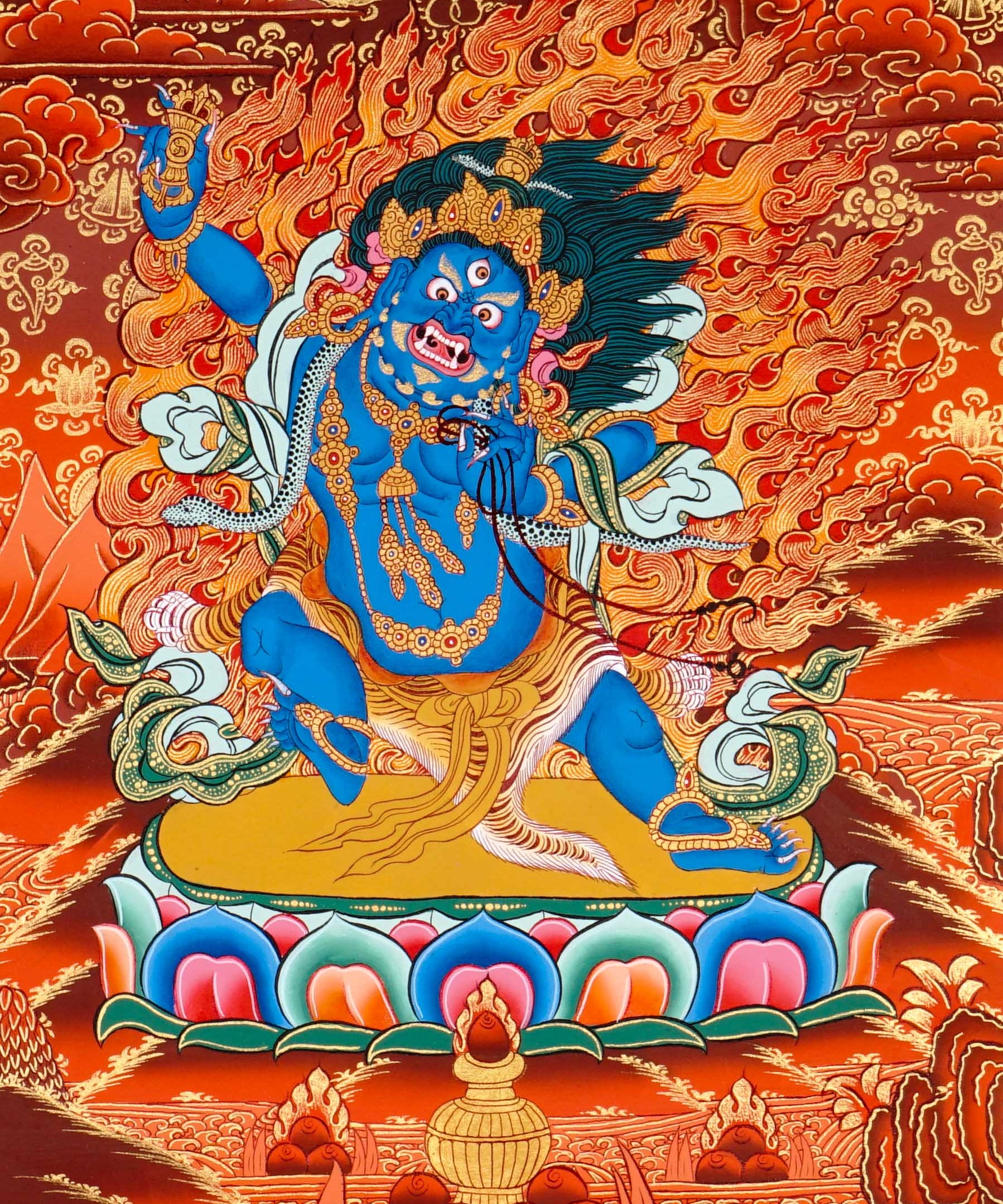 Vajrapani thangka painting showing a blue wrathful Tibetan Buddhist protector deity holding a raised vajra, surrounded by flames and seated on a lotus throne against a vivid orange-red background.