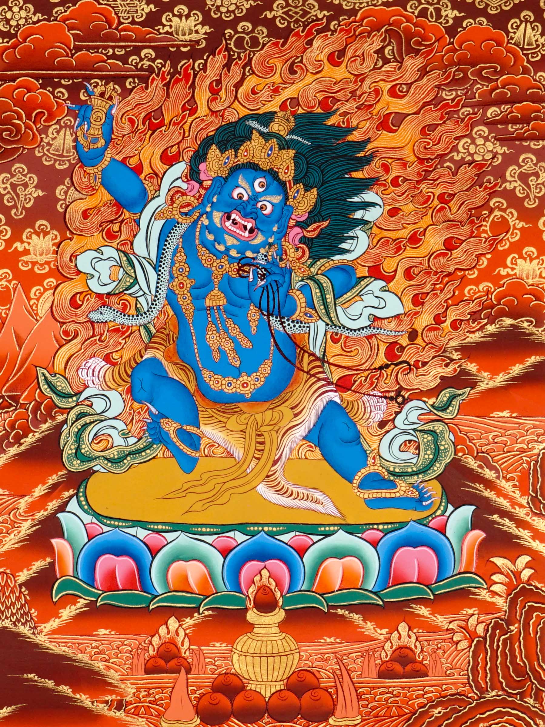 Vajrapani thangka painting showing a blue wrathful Tibetan Buddhist protector deity holding a raised vajra, surrounded by flames and seated on a lotus throne against a vivid orange-red background.