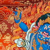 Vajrapani thangka painting showing a blue wrathful Tibetan Buddhist protector deity holding a raised vajra, surrounded by flames and seated on a lotus throne against a vivid orange-red background.