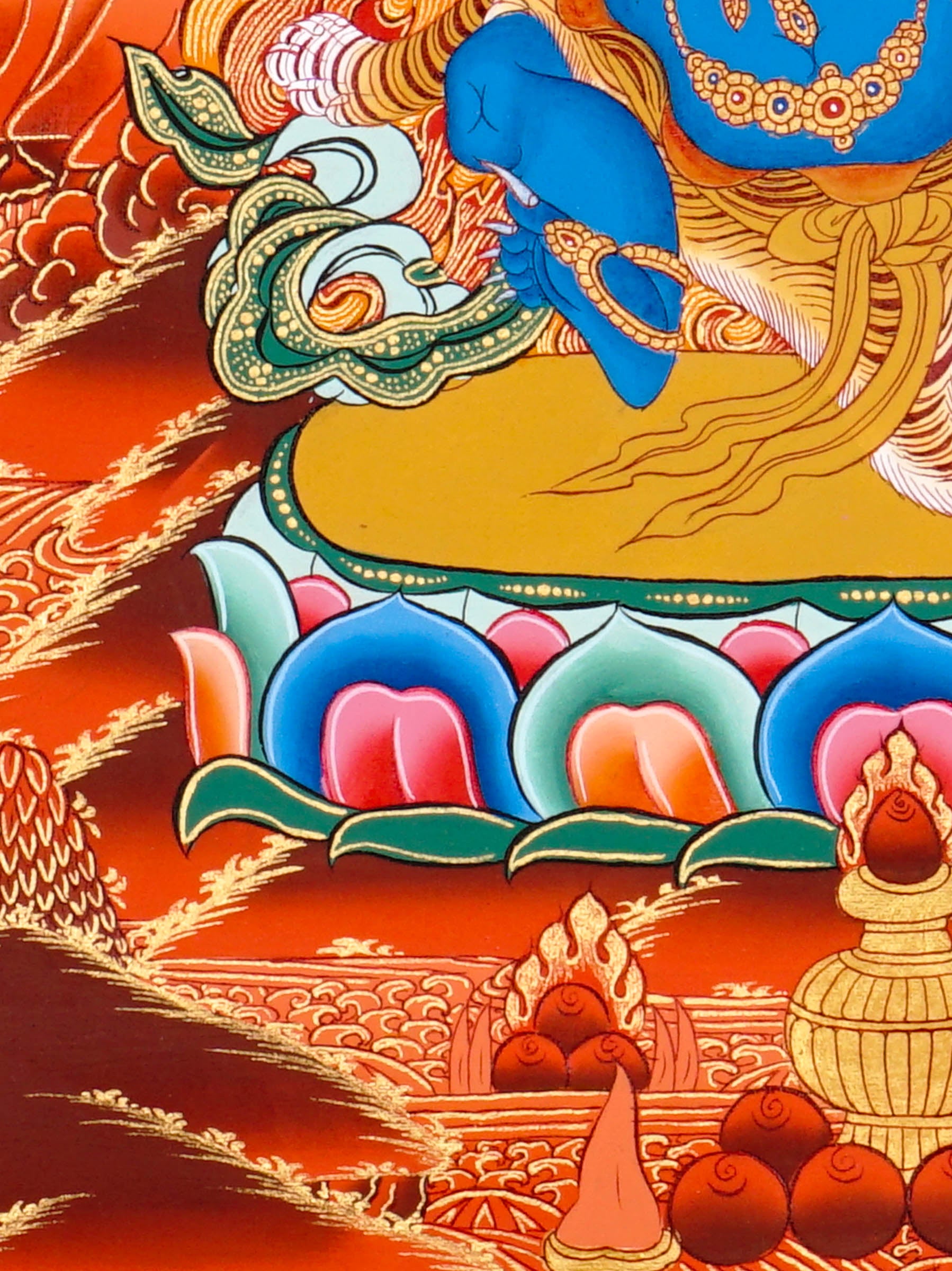 Vajrapani thangka painting showing a blue wrathful Tibetan Buddhist protector deity holding a raised vajra, surrounded by flames and seated on a lotus throne against a vivid orange-red background.