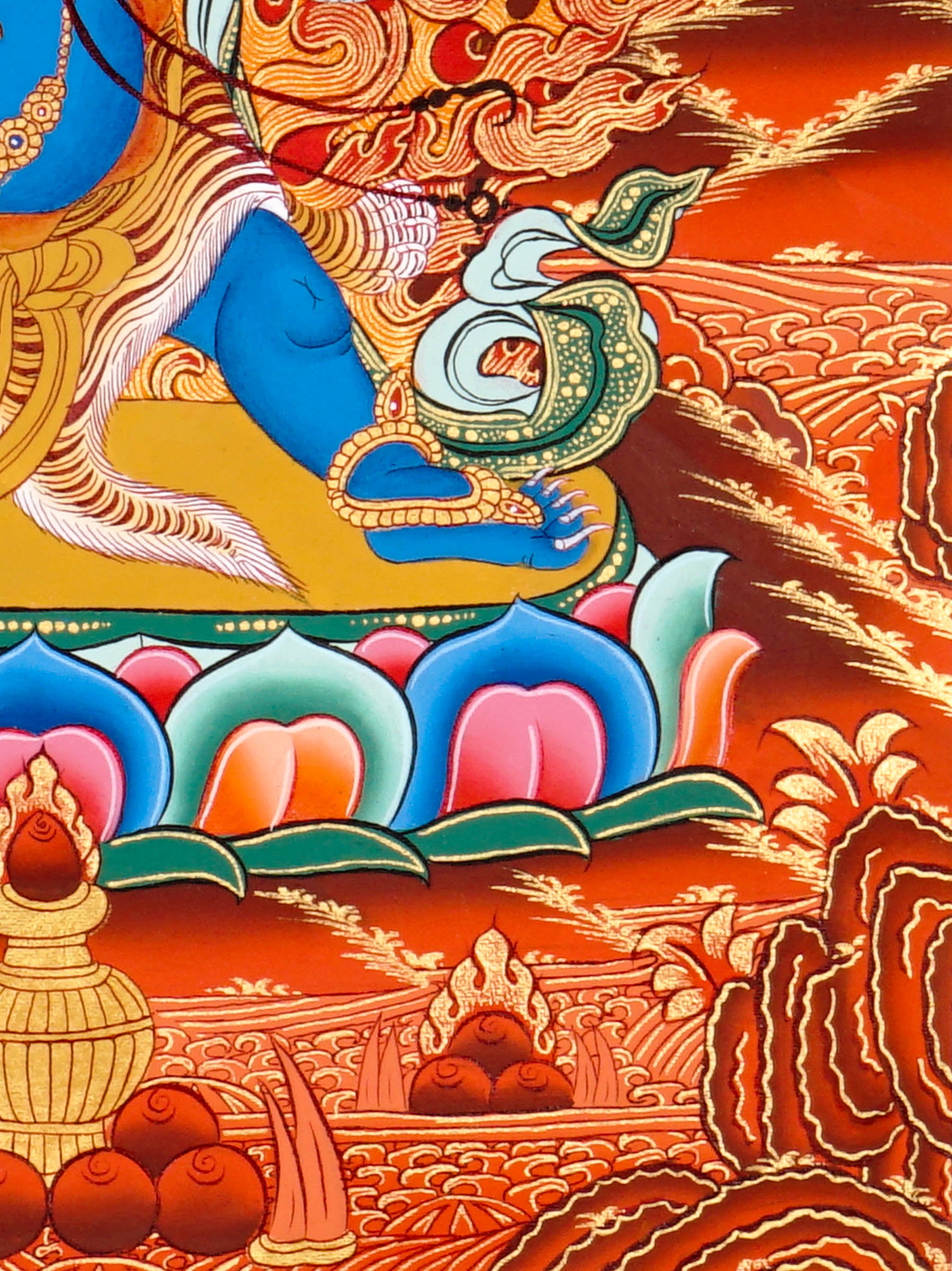 Vajrapani thangka painting showing a blue wrathful Tibetan Buddhist protector deity holding a raised vajra, surrounded by flames and seated on a lotus throne against a vivid orange-red background.