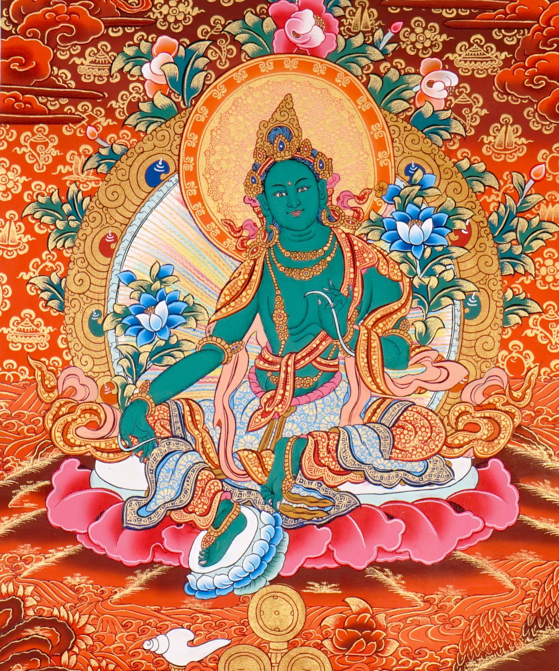 Green Tara Thangka Painting showing the Tibetan Buddhist goddess seated on a pink lotus throne with one leg extended, holding a lotus flower, surrounded by a radiant halo, sacred ornaments and red-gold background.