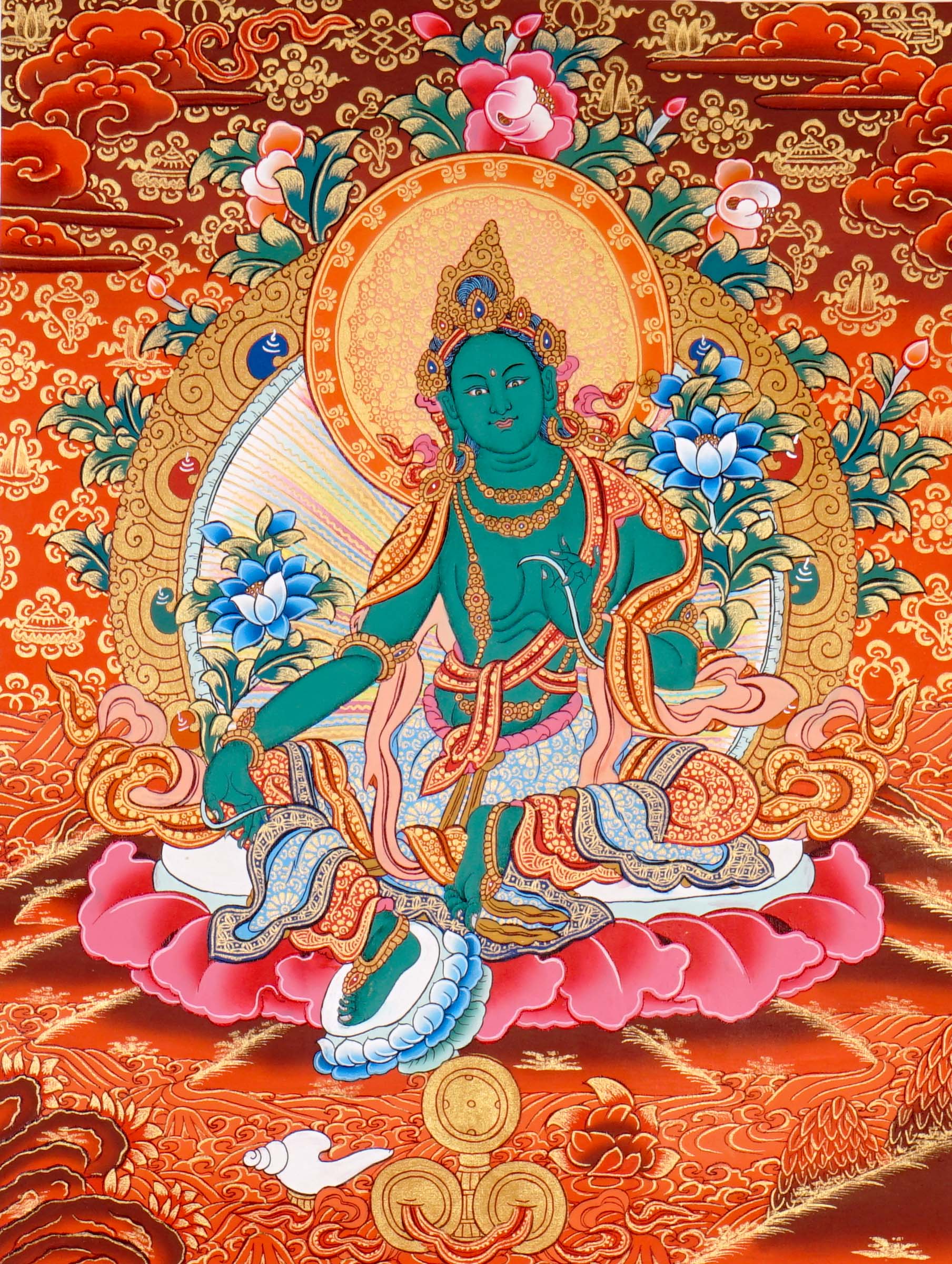Green Tara Thangka Painting showing the Tibetan Buddhist goddess seated on a pink lotus throne with one leg extended, holding a lotus flower, surrounded by a radiant halo, sacred ornaments and red-gold background.