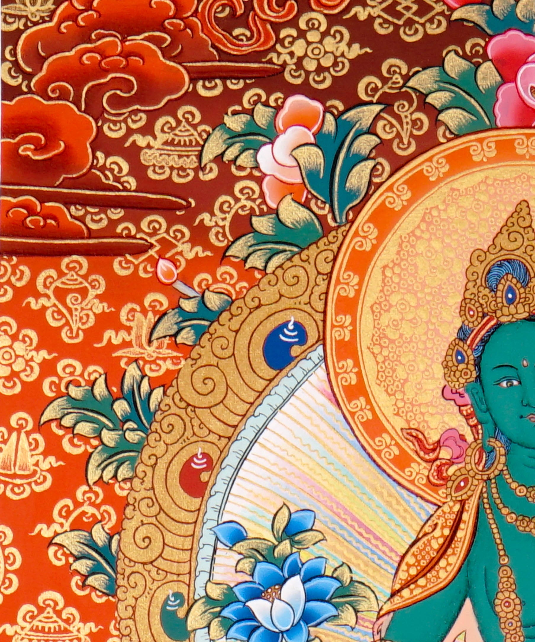 Green Tara Thangka Painting showing the Tibetan Buddhist goddess seated on a pink lotus throne with one leg extended, holding a lotus flower, surrounded by a radiant halo, sacred ornaments and red-gold background.