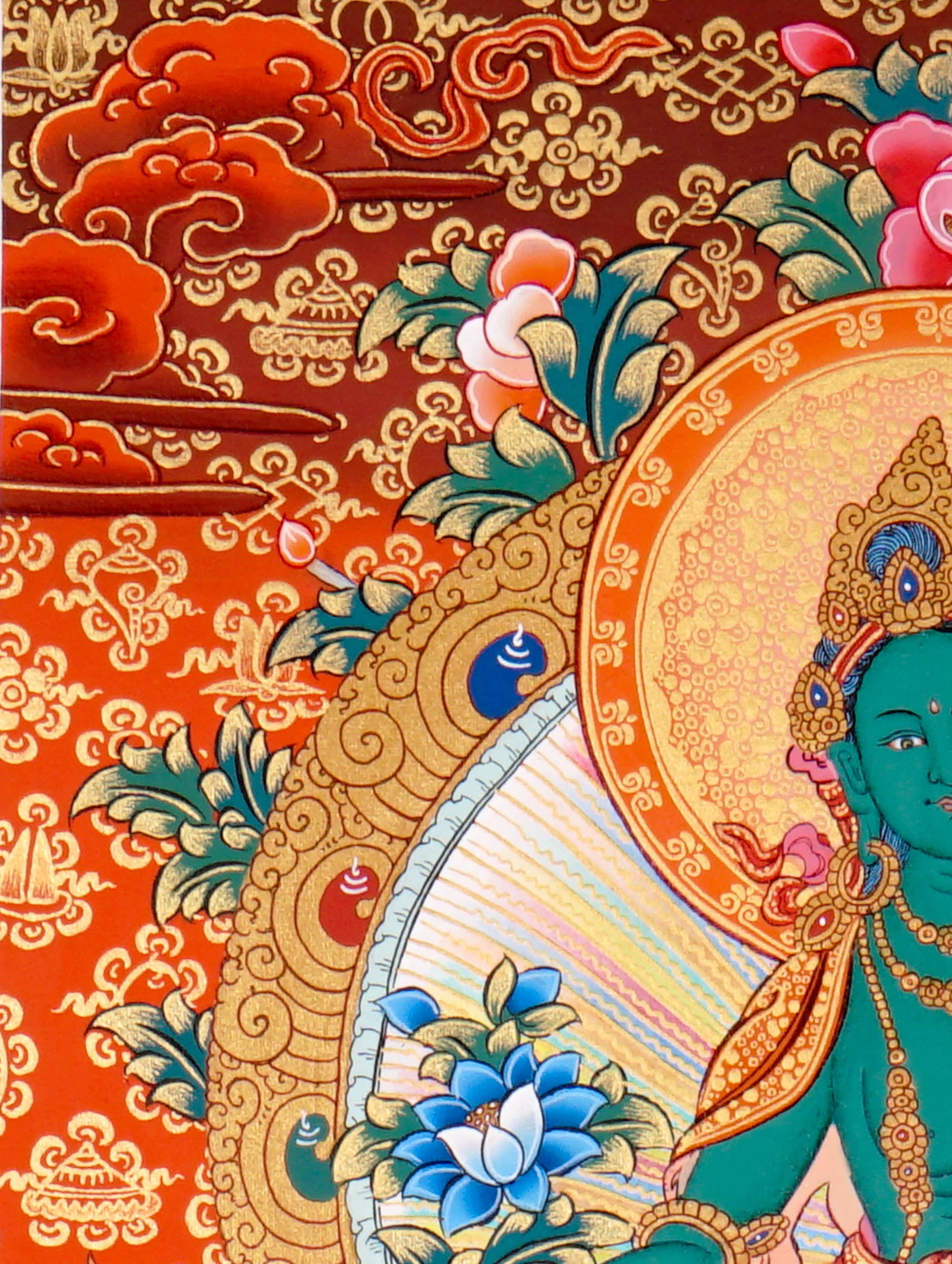 Green Tara Thangka Painting showing the Tibetan Buddhist goddess seated on a pink lotus throne with one leg extended, holding a lotus flower, surrounded by a radiant halo, sacred ornaments and red-gold background.
