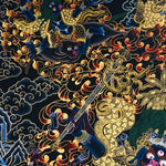 Close-up detail of Palden Lhamo Thangka Painting, wrathful female protector riding through flames and dark clouds with gold detailing