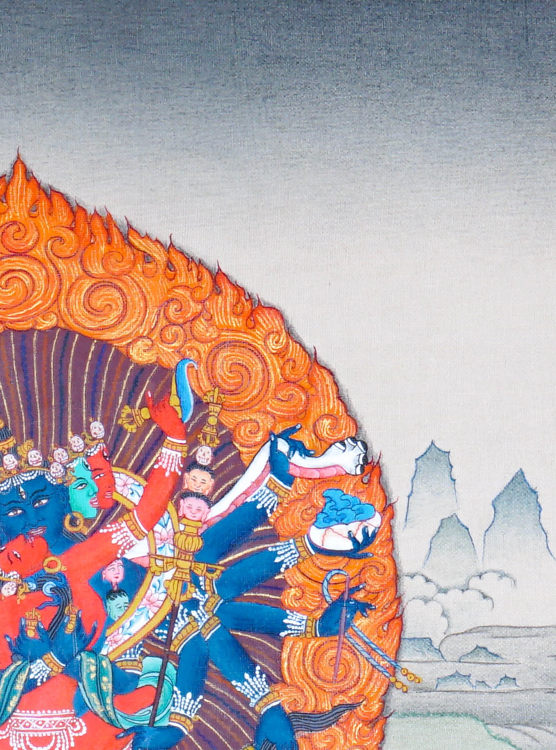 Chakrasamvara Thangka Painting showing Heruka in union with Vajravarahi, surrounded by a flame aura, ritual implements, lotus base and sacred Himalayan landscape details.