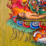 Mahakala Oil Painting showing a wrathful Tibetan Buddhist Dharma protector with black face, skull crown, curved knife, skull cup, flame aura, lotus base, offering symbols and golden textured background.