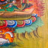 Mahakala Oil Painting showing a wrathful Tibetan Buddhist Dharma protector with black face, skull crown, curved knife, skull cup, flame aura, lotus base, offering symbols and golden textured background.