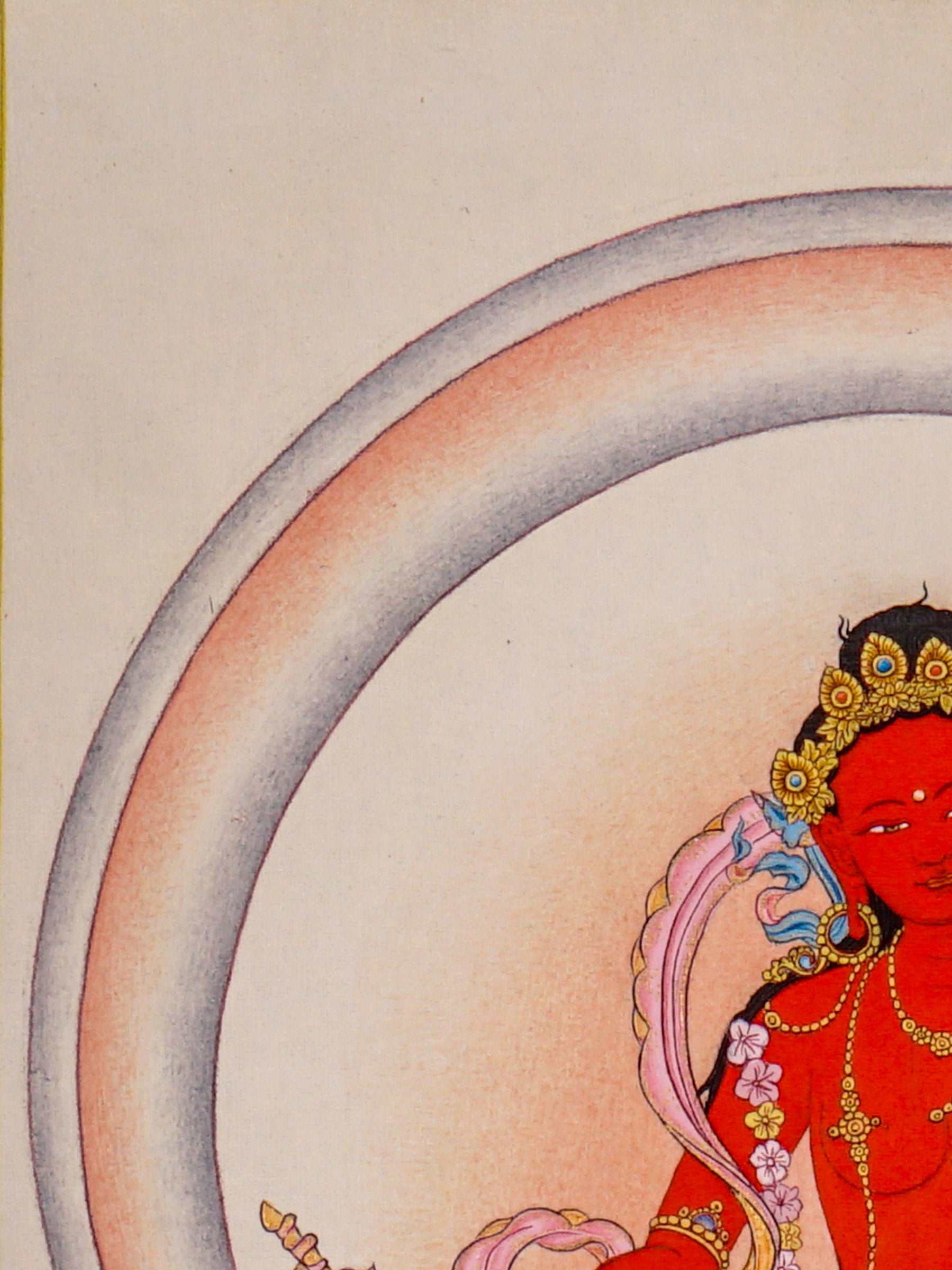 Red Tara thangka painting featuring Tara seated on a pink lotus throne with a lotus flower, radiant halo, ornaments