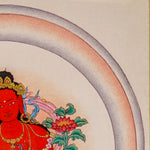 Red Tara thangka painting featuring Tara seated on a pink lotus throne with a lotus flower, radiant halo, ornaments
