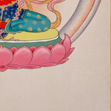 Red Tara thangka painting featuring Tara seated on a pink lotus throne with a lotus flower, radiant halo, ornaments
